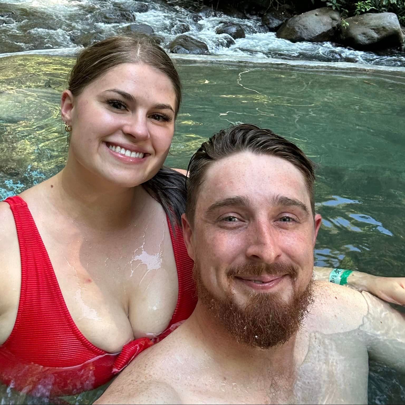 Happy Customer A man and a woman are taking a selfie in a pool.