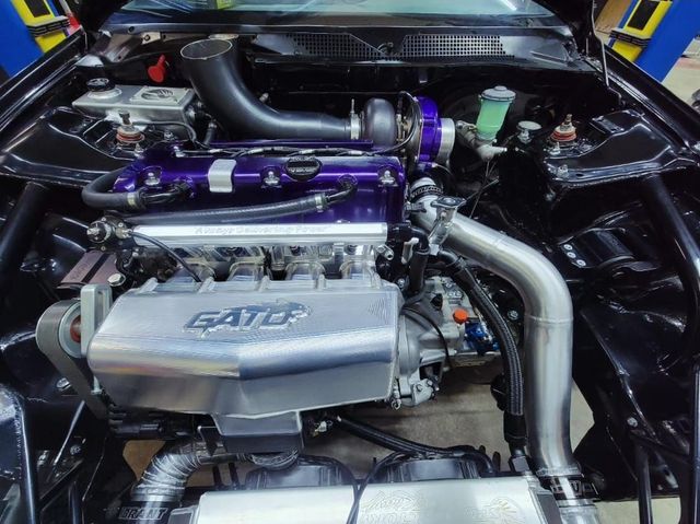 Close-Up Of Turbocharged Engine Bay With Purple Components | YTS Auto Repair