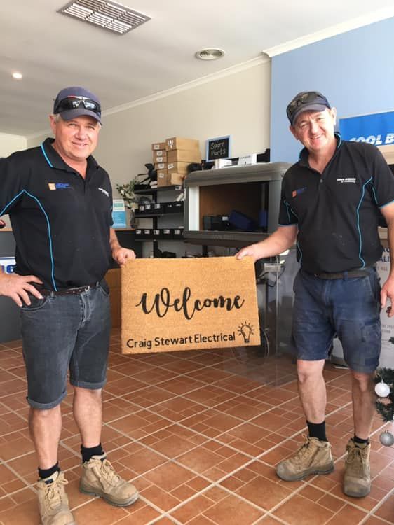 Two men in work uniforms — Craig Stewart Electrical in East Wagga Wagga, NSW