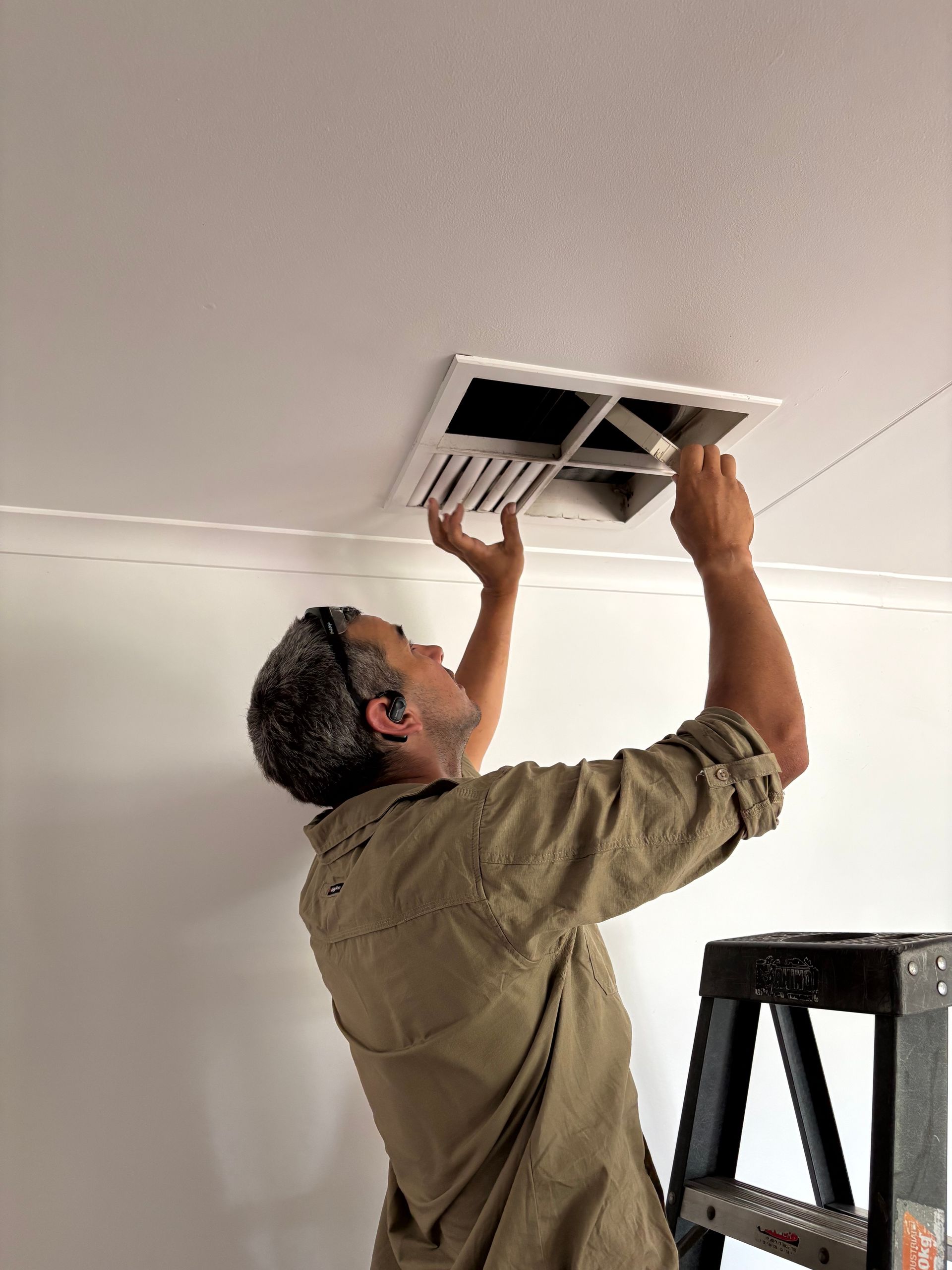 Brown Evaporative Cooler on a Red Roof — Craig Stewart Electrical in East Wagga Wagga, NSW