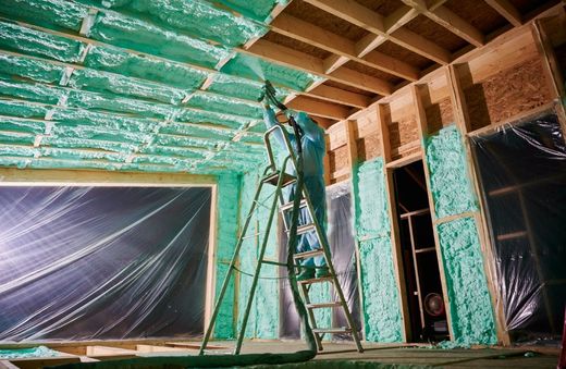 Spray foam insulation applied to wall and ceiling framing in a Surprise, AZ home