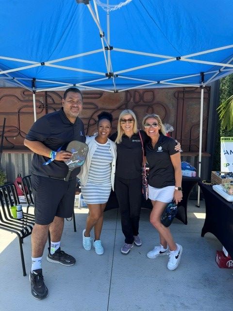 PWI 2026 Pickleball Tournament - four people under a tent