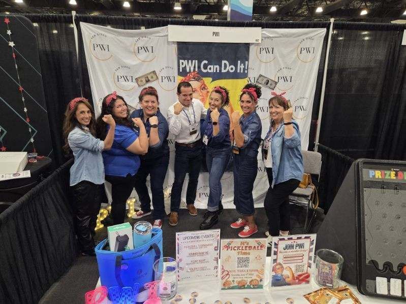 seven PWI members show their strength at the PWI booth.