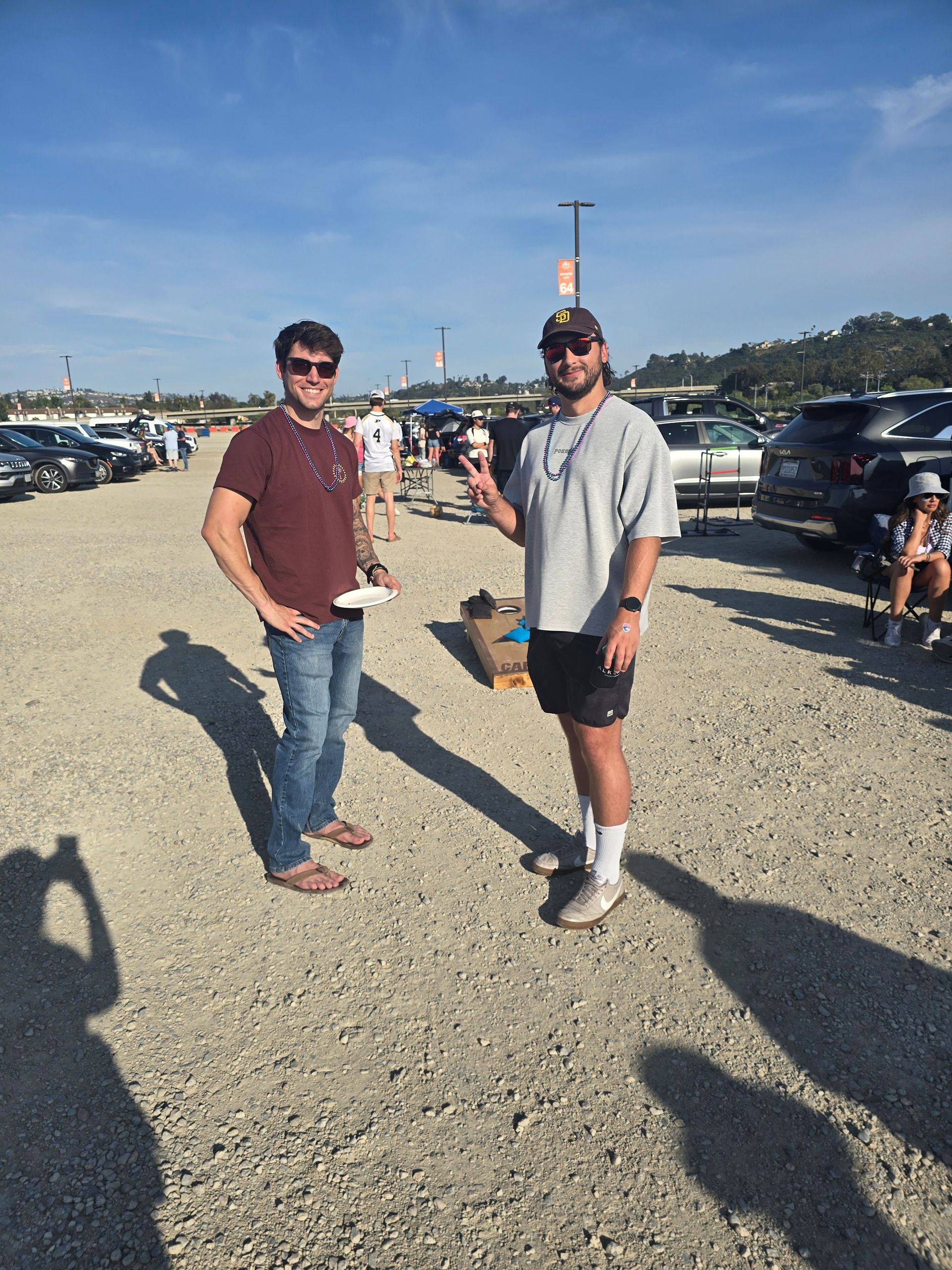 2026 Waves Soccer Game and Tailgate - Two members in the parking lot for the tailgate