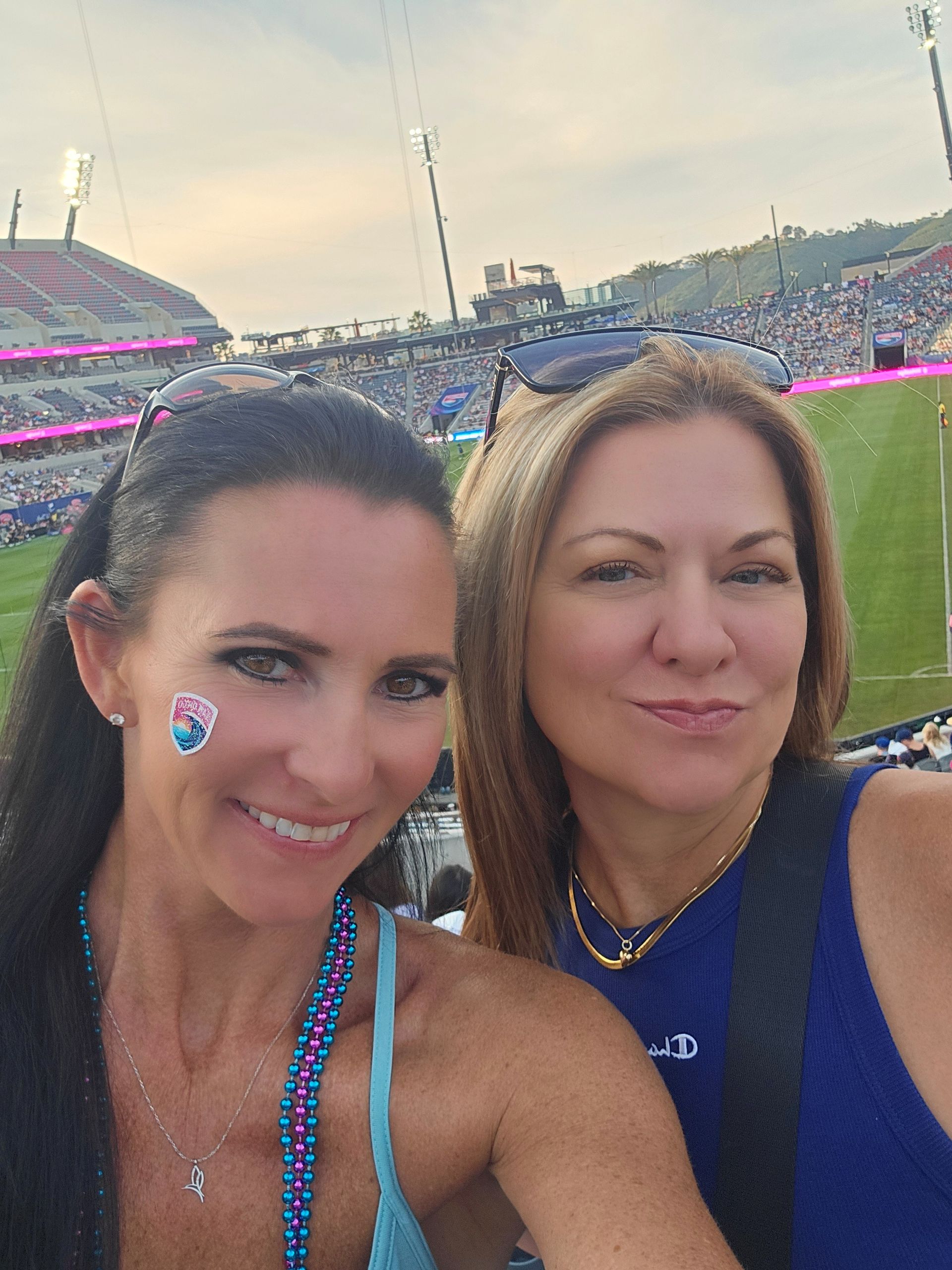 2026 Waves Soccer Game and Tailgate - Two members in the stands