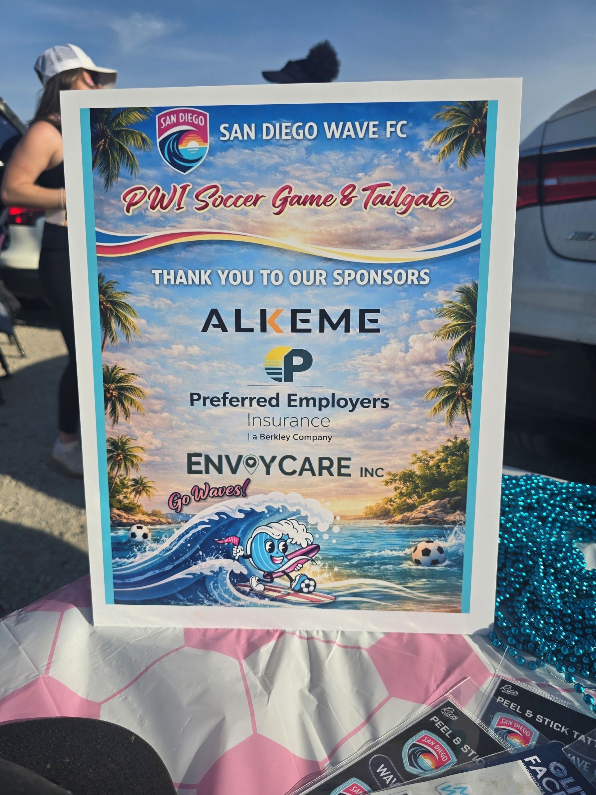 PWI Soccer Event signage with sponsors Alkeme, Preferred Employers, and Envoy Care listed.