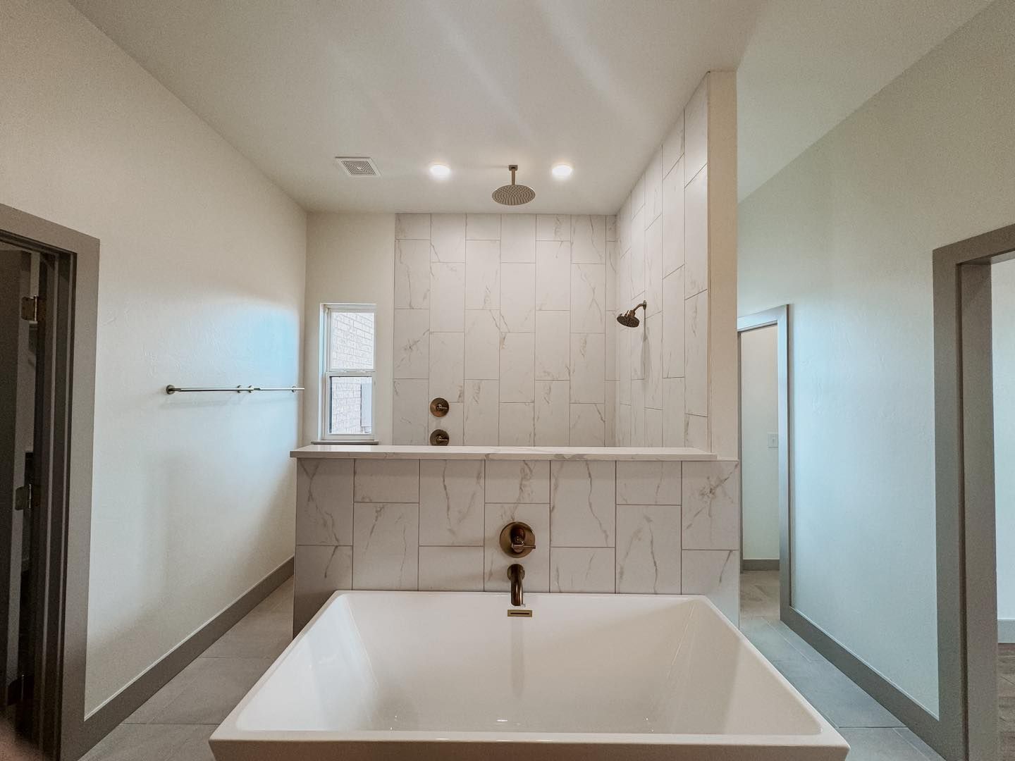 there is a large bathtub in the middle of the bathroom