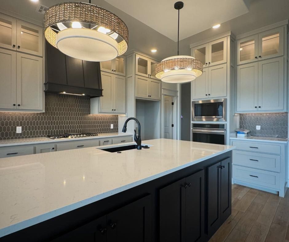 there is a large island in the middle of the kitchen