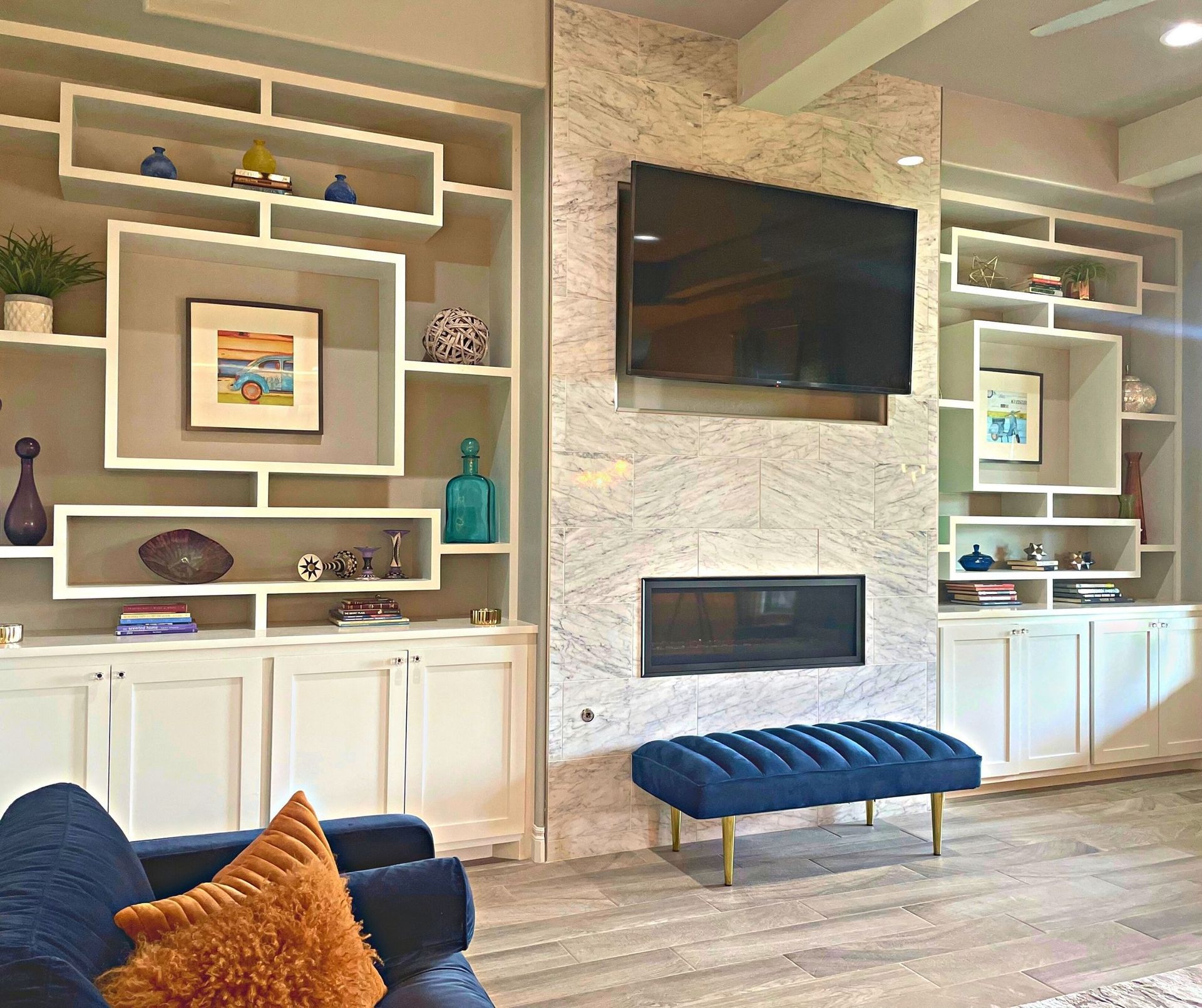 a living room with a fireplace and a flat screen tv