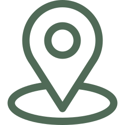 A green map pin with a circle in the middle of it.