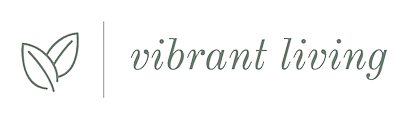 A logo for vibrant living with a heart and leaves.
