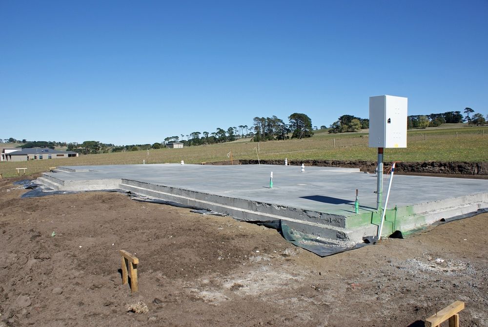 A White Box Is On A Pole In The Middle Of A Dirt Field — A2Z Property Services In Widgee, QLD