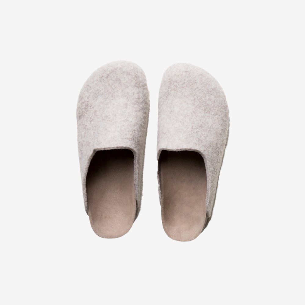 Pair of light gray felt clogs.