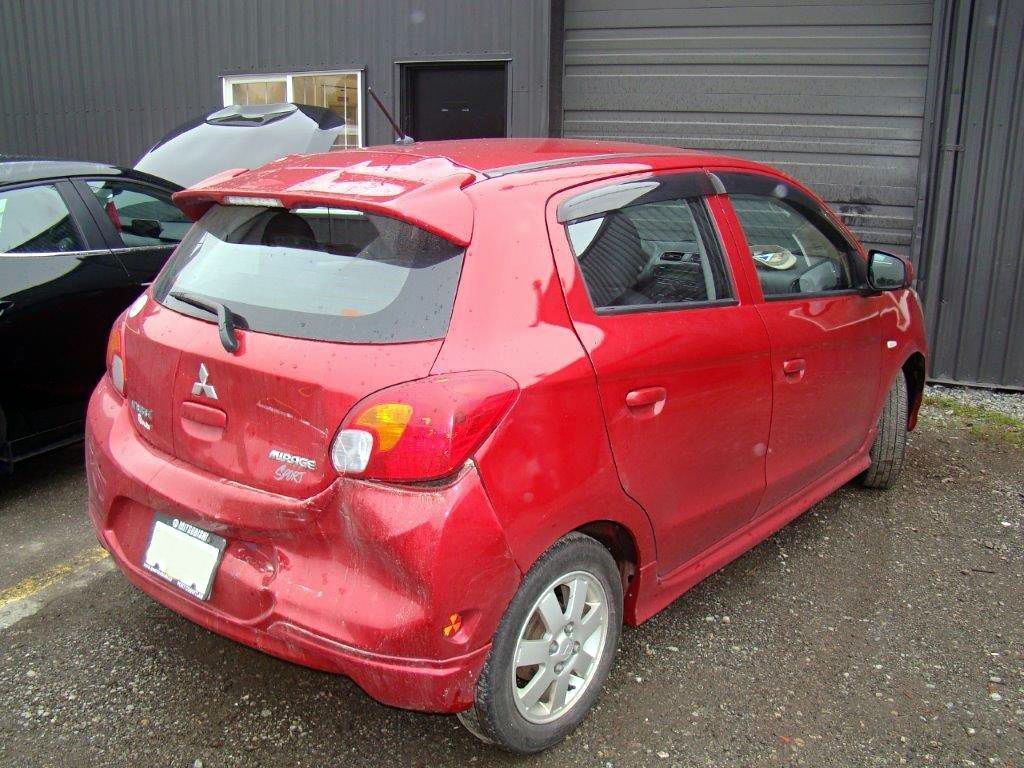 Before: Rear-end damage on black SUV
