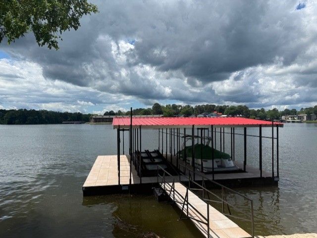 A boat is docked at a dock with a sign that says boat rental