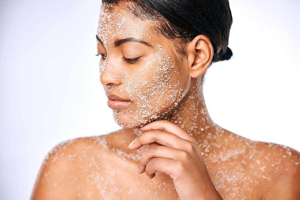 A woman is getting a facial treatment at a beauty salon.