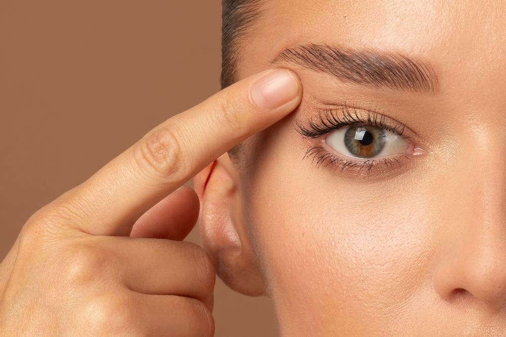 A woman is getting a facial treatment at a beauty salon.
