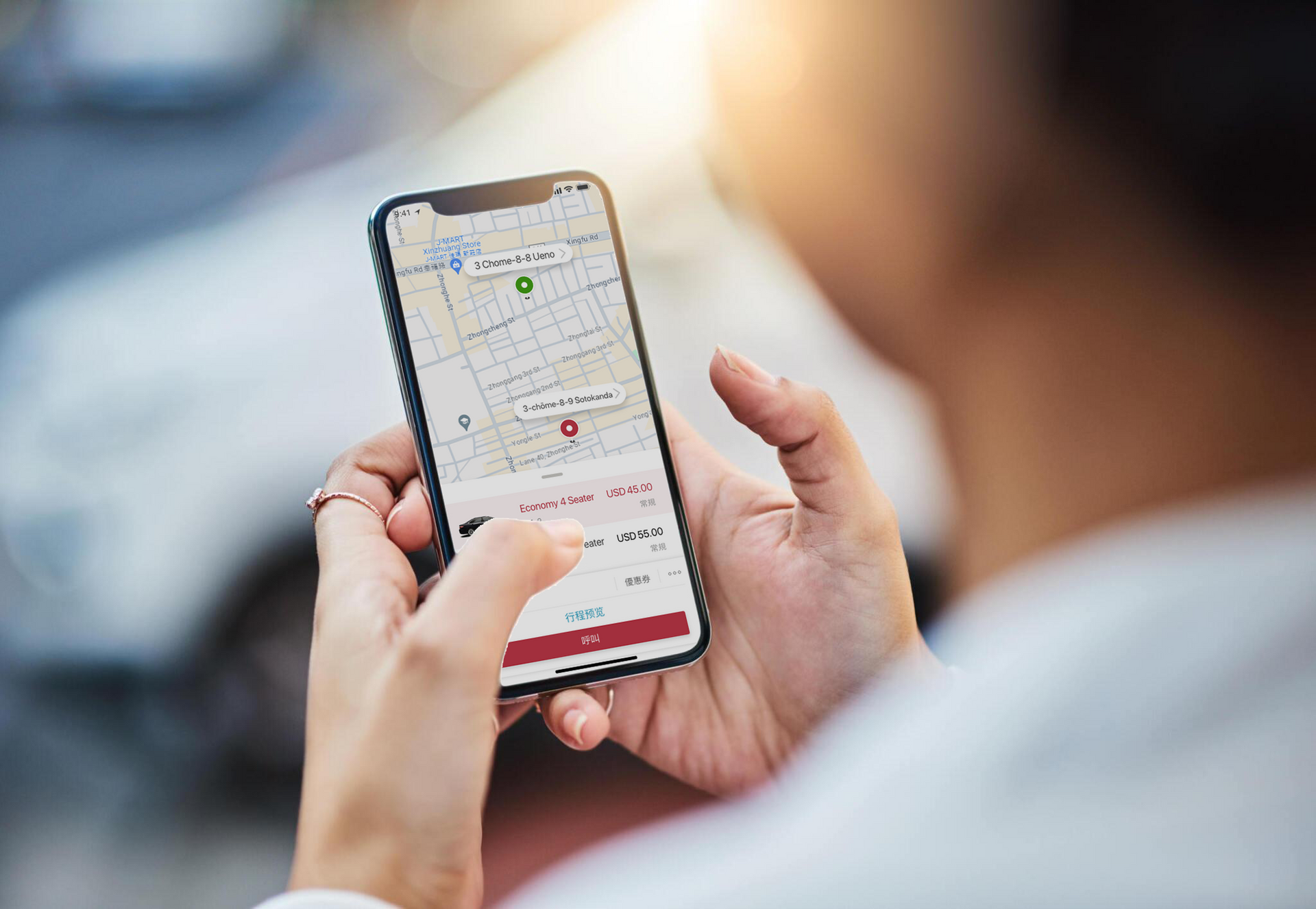 A person is holding a cell phone with a map on it