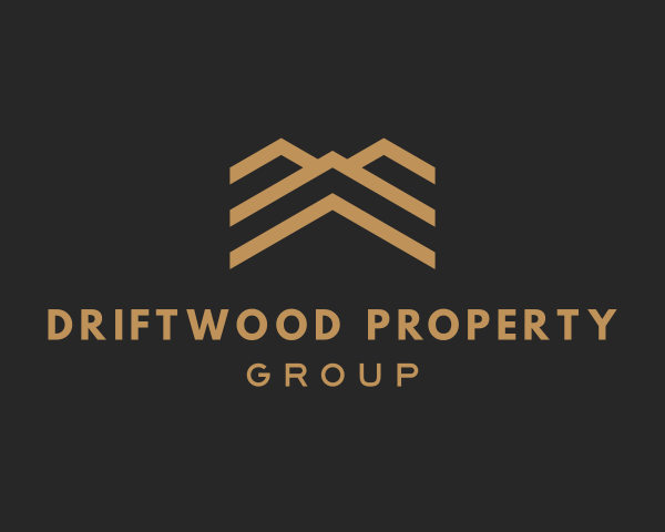Logo for Driftwood Property Group, gold house icon above text on a dark background.