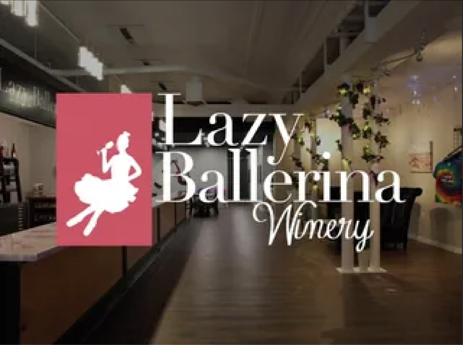 A sign for lazy ballerina winery with a ballerina on it