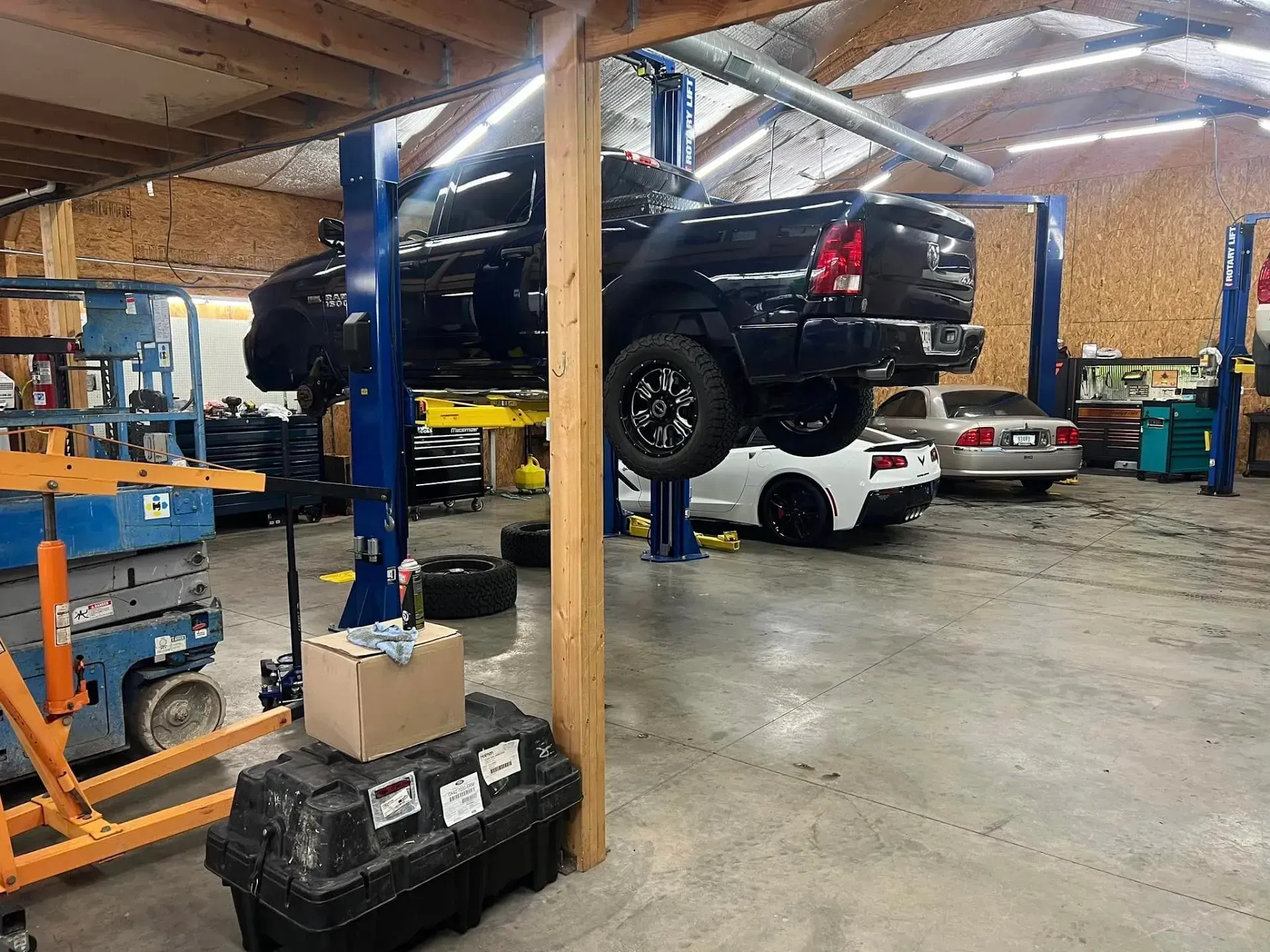 Truck on a Lift in a Garage | Auto Care Center