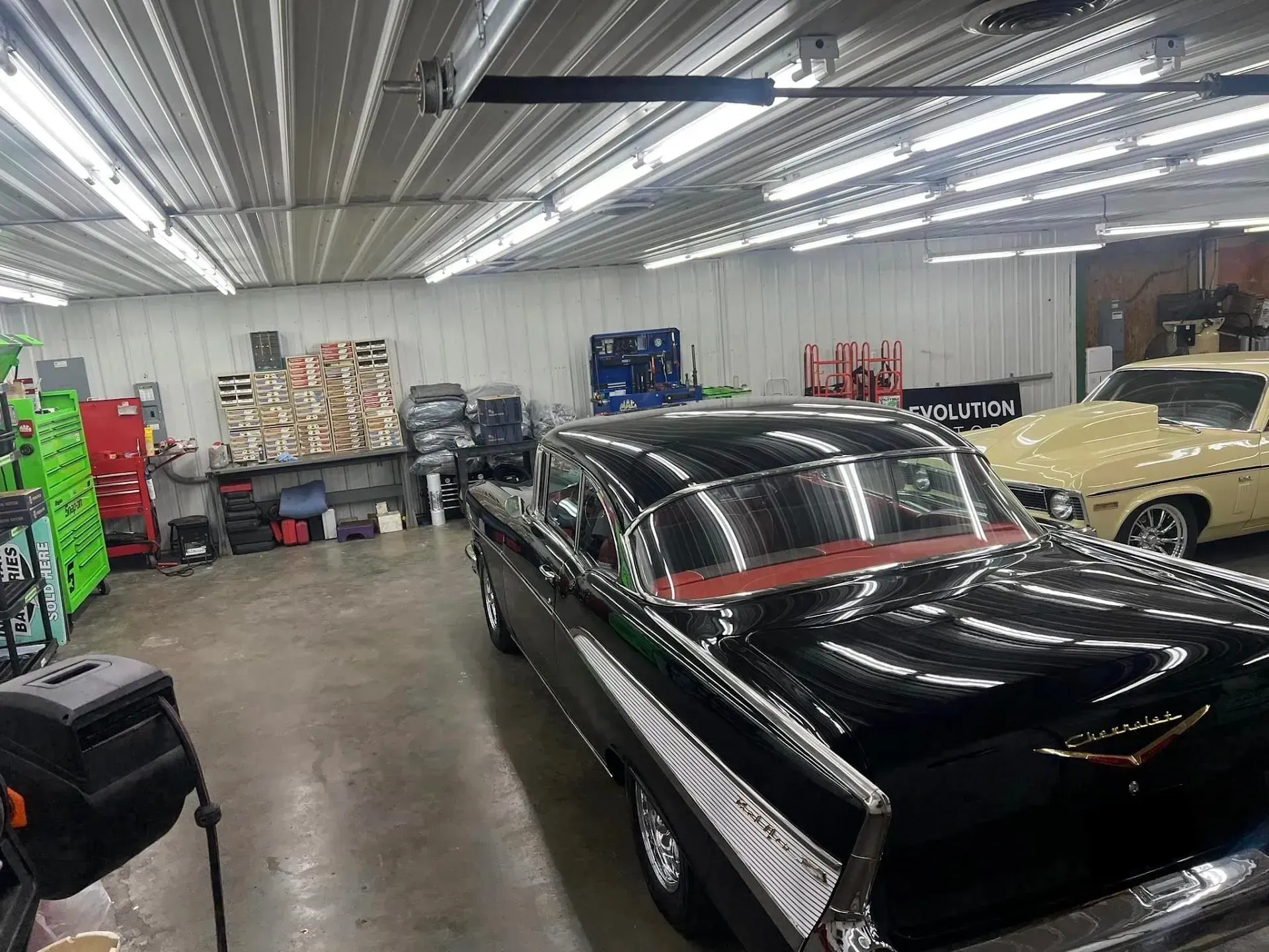Black Classic Car in a Well-Lit Garage | Auto Care Center