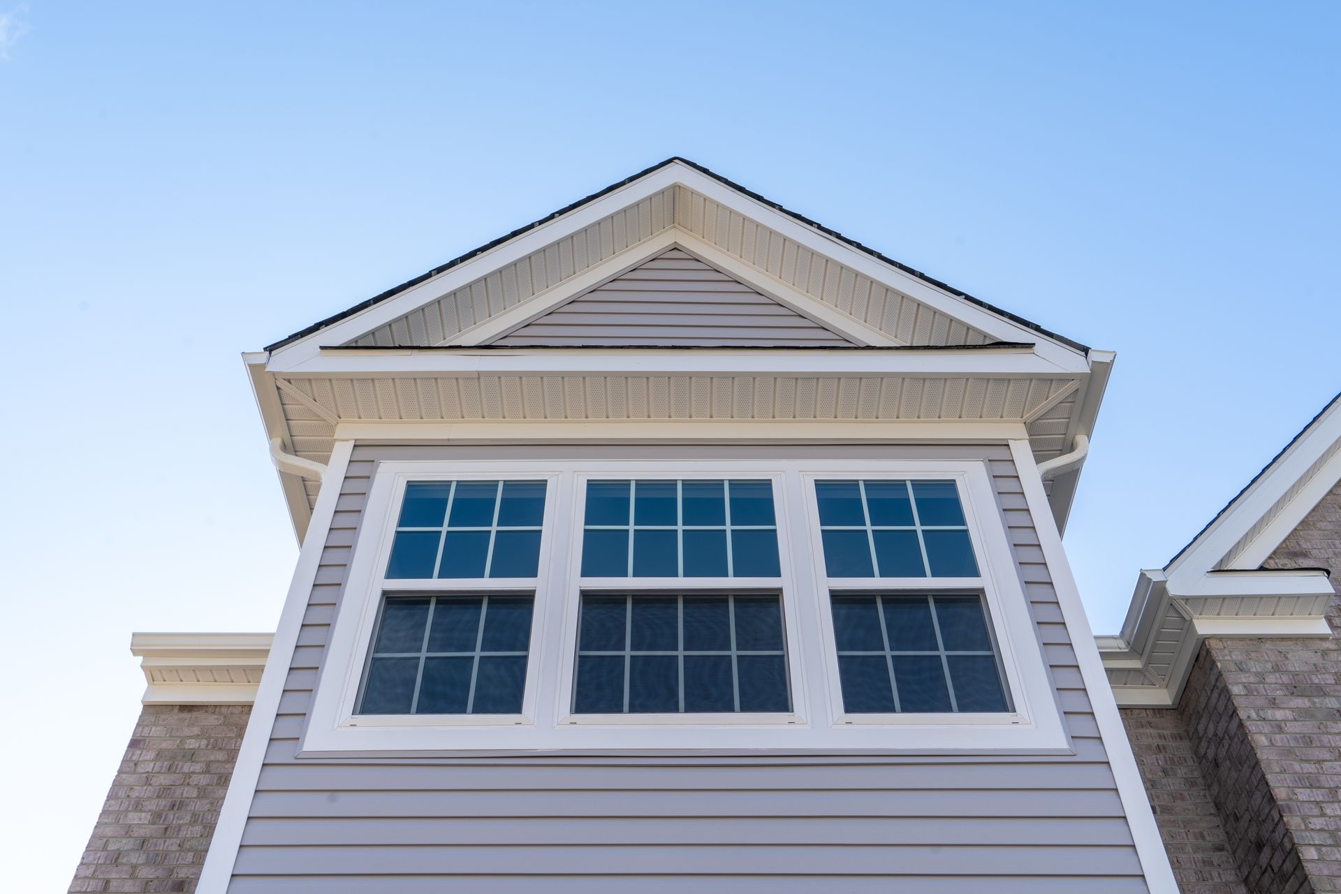 Double hung window with fixed top sash and bottom sash that slides up