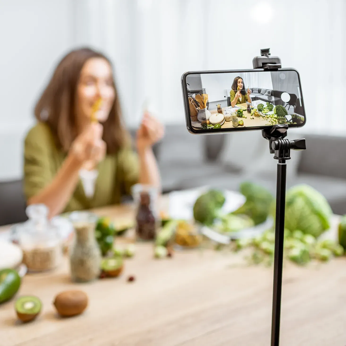 Female food influencer recording a  video inside her home studio