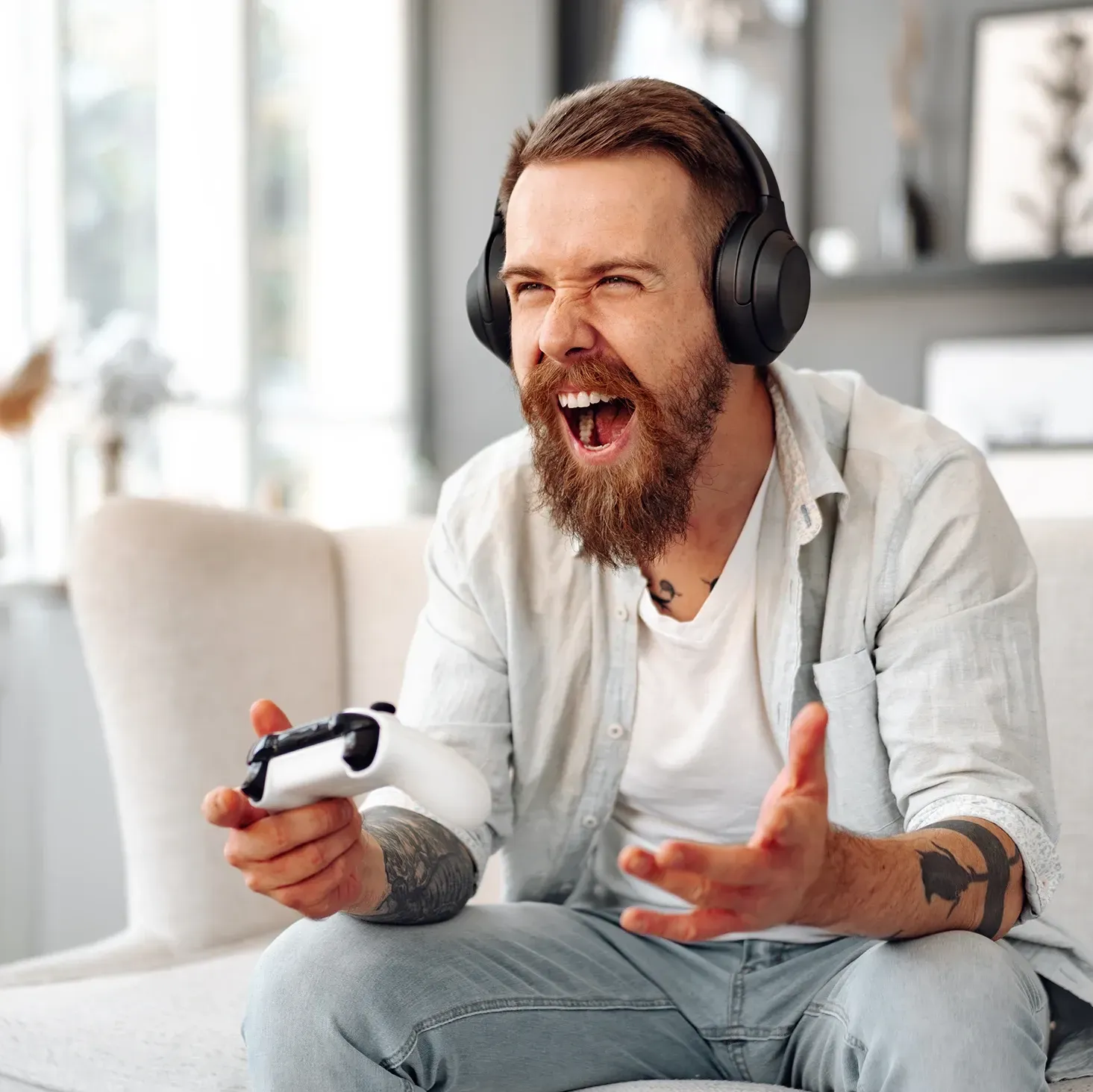 Male gamer getting excited playing a video game