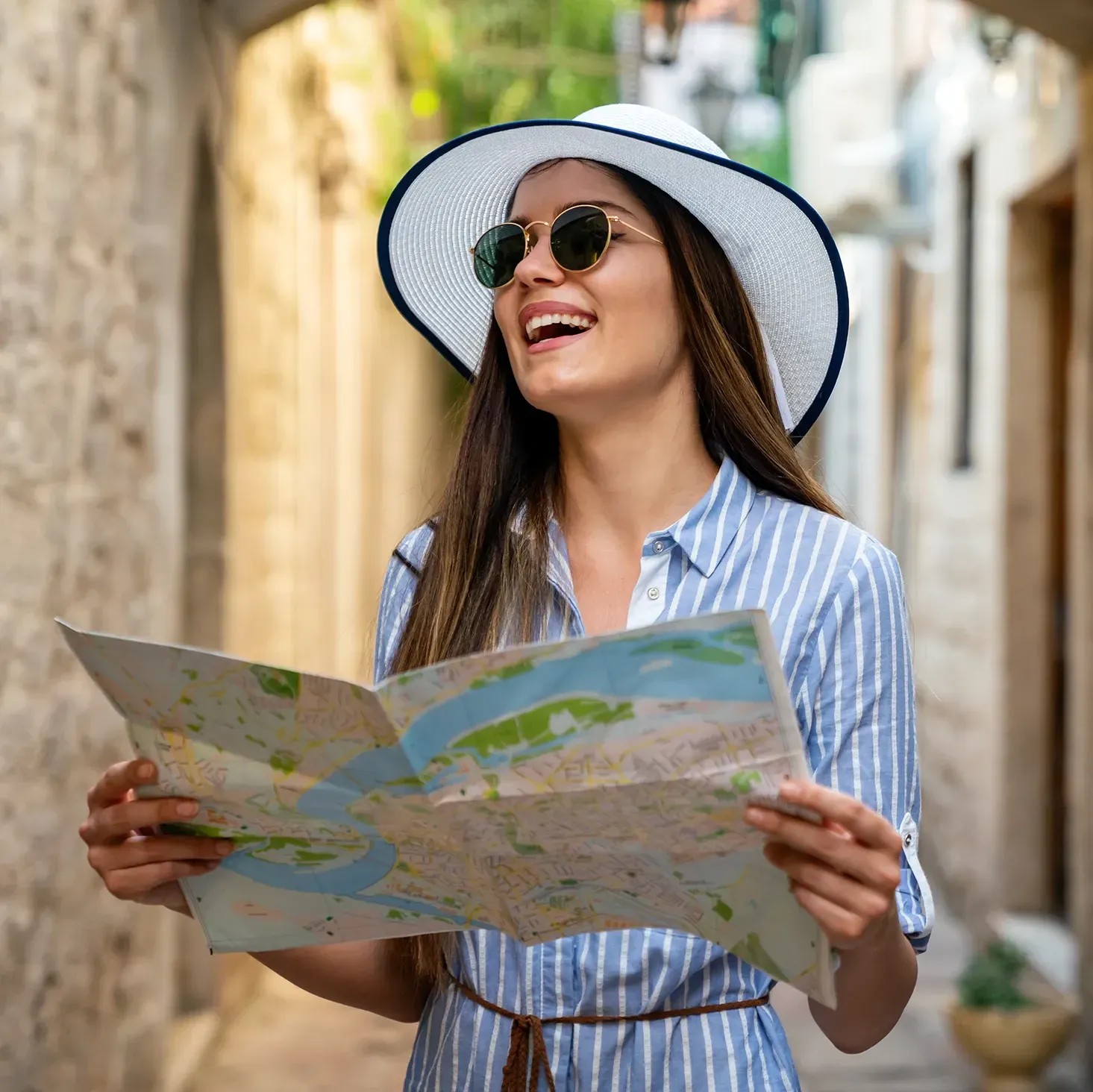 YouTuber walking around a foreign town holding a city map