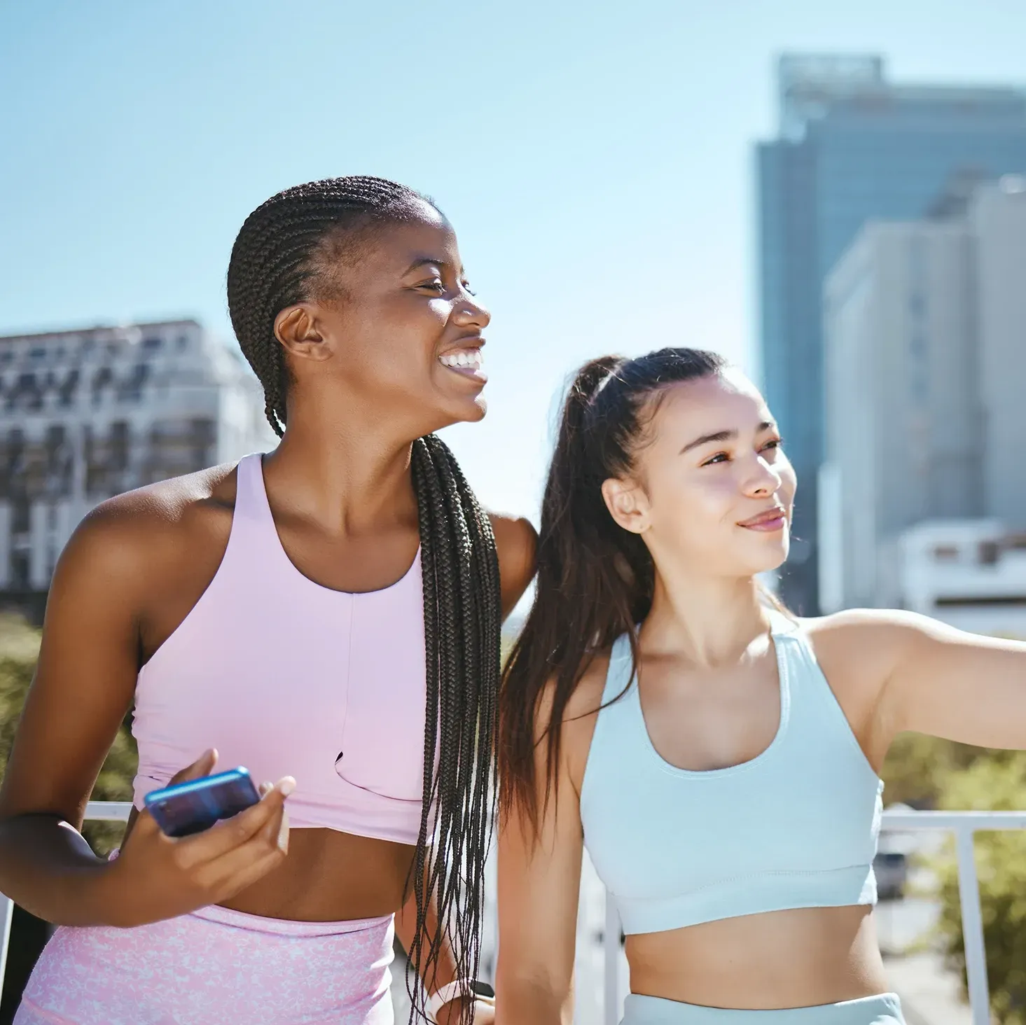 Young health and fitness influencers recording a video outside in a city