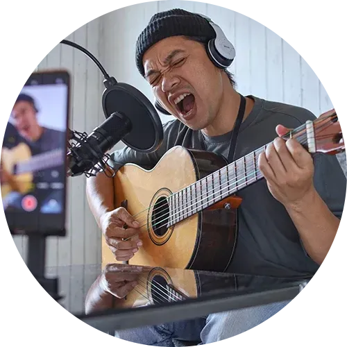 Young YouTuber recording a song for his social media channel