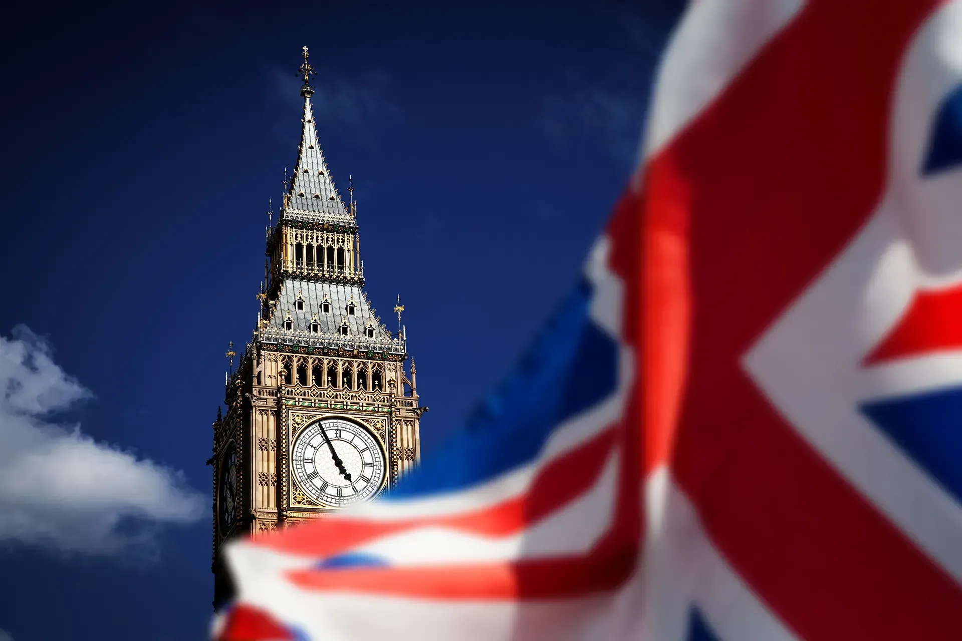 Big Ben behind the flag of the UK