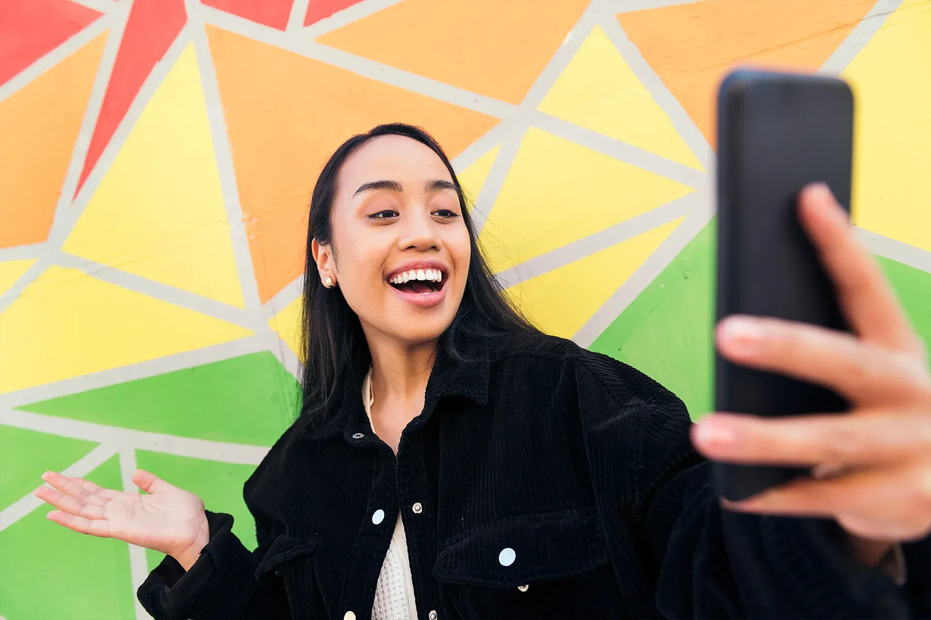 Female creator recording content on her phone