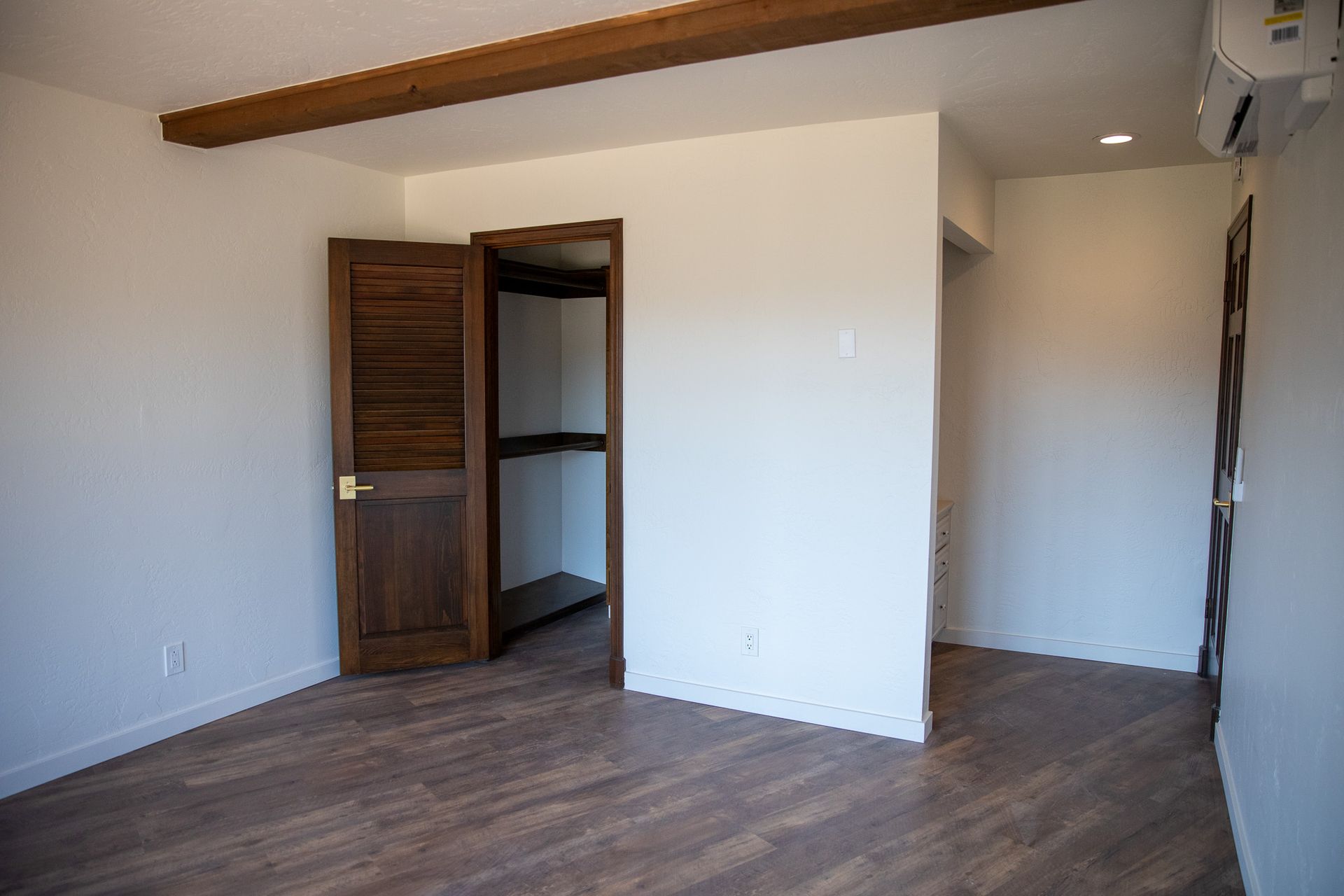 There is a closet in the middle of the room.