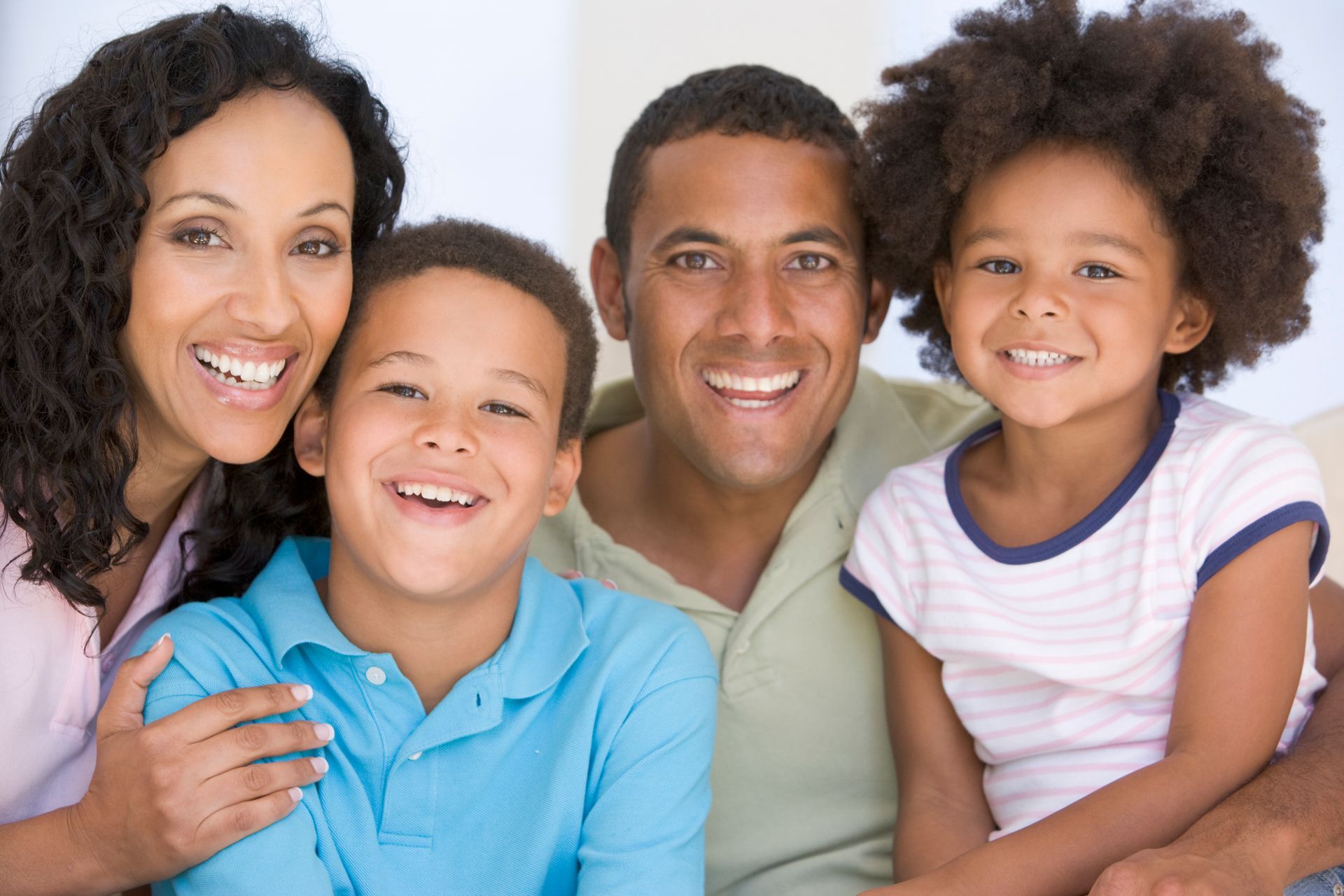Happy family learning about health insurance open enrollment
