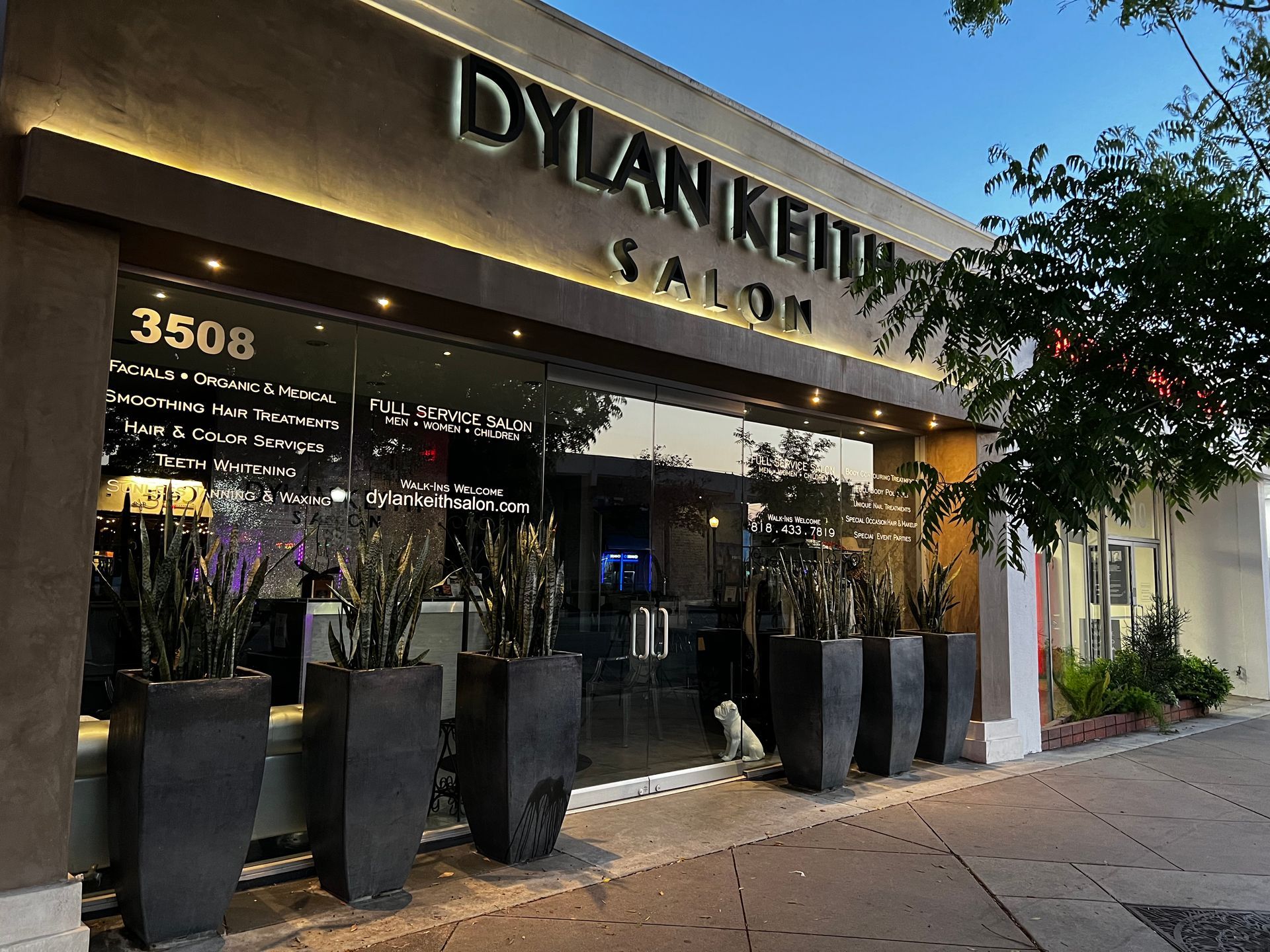 A building with a sign that says dylan keith salon