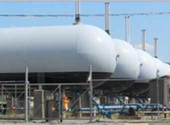 A residential above-ground propane tank. A residential above-ground propane tank.