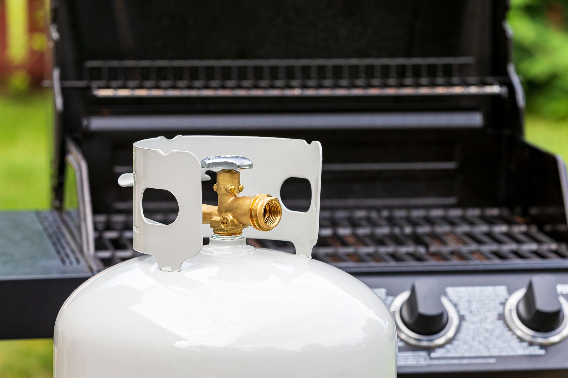 Backyard propane tank valve adjustment.