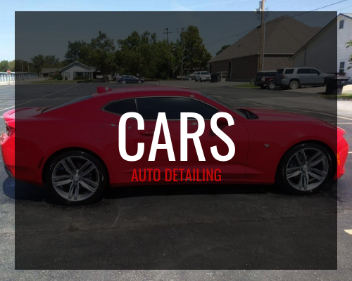 Red sports car with “CARS AUTO DETAILING” text over a parking lot background