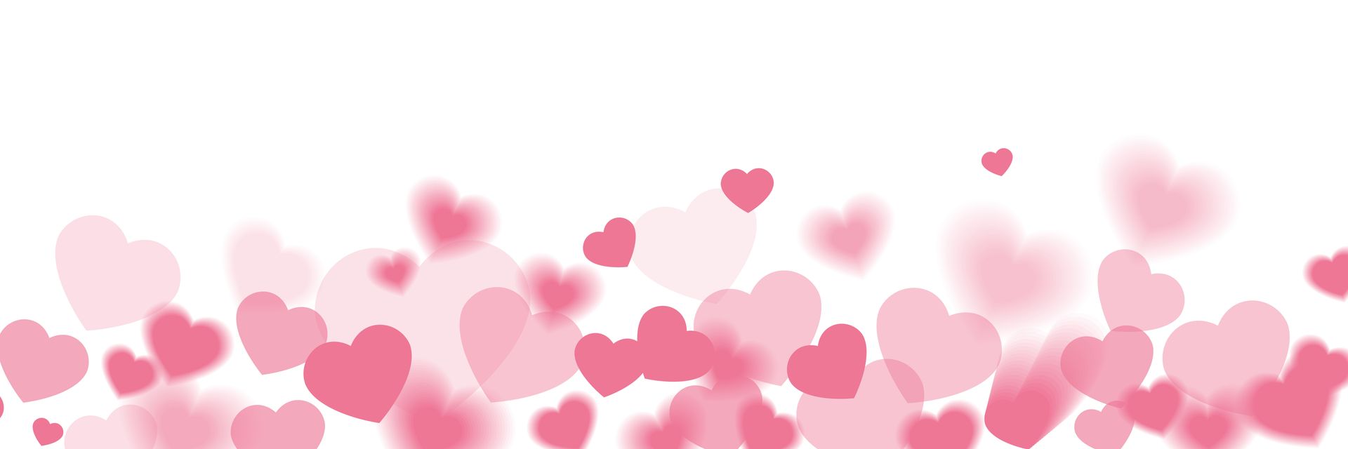 Pink and red hearts floating above a white background