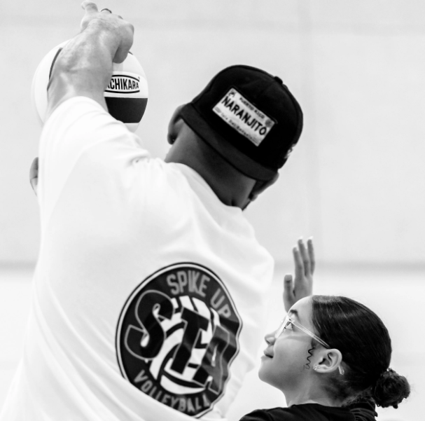 Coach Mark coaching a young player