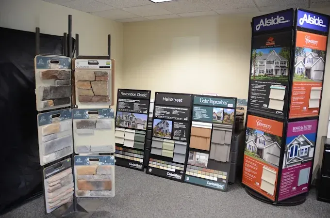 Display of real estate brochures and standing signs in an office lobby.
