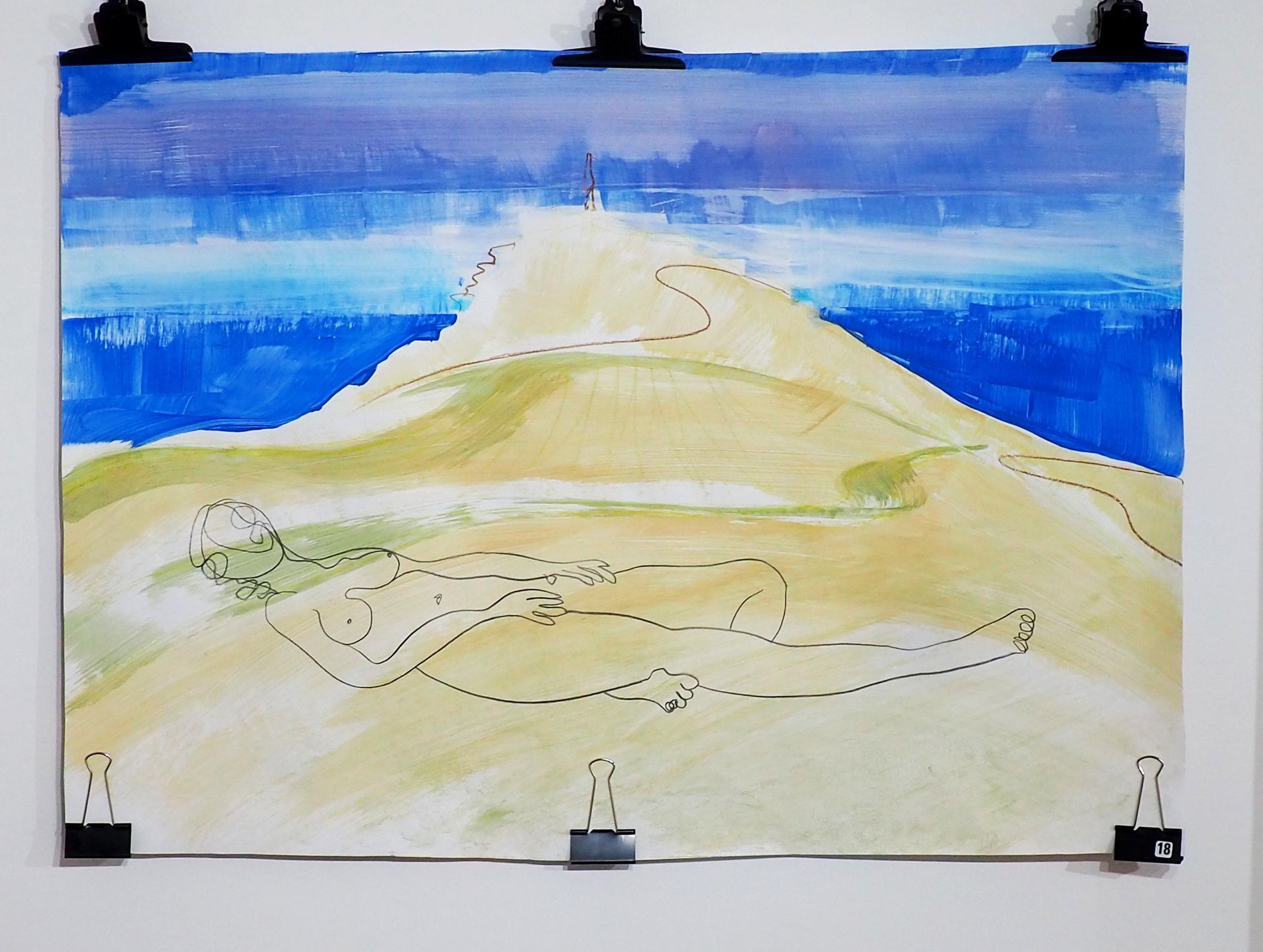A hill (Cape Cornwall) formed with large yellowy / green brush strokes. Blue sea and sky in the back ground. Foreground has a simple black line drawing of a reclined naked figure.