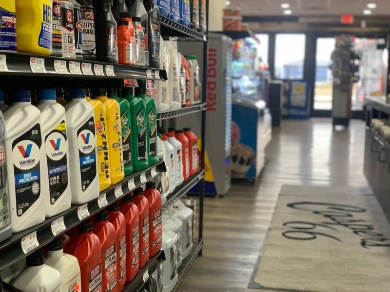 A store aisle filled with lots of bottles of oil