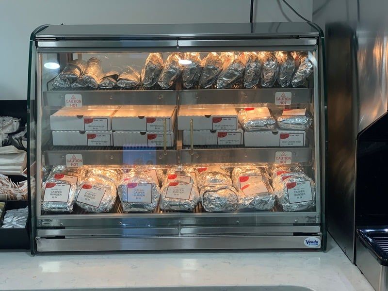 A display case with a lot of food in it