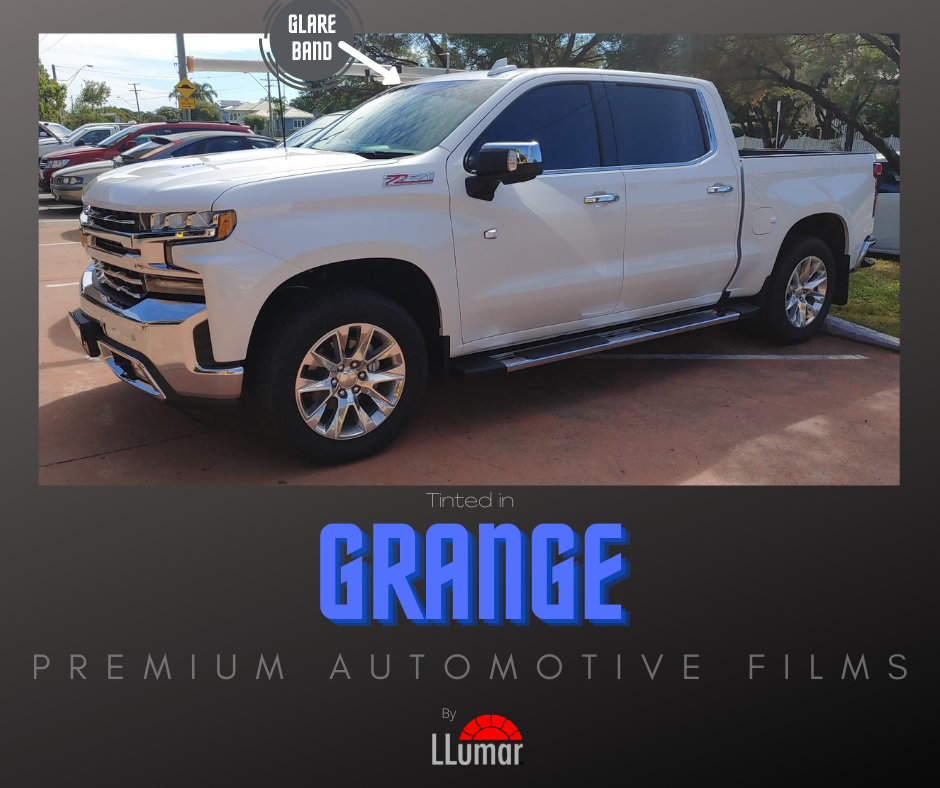White pickup truck with tinted windows, featuring a front windshield glare band, under the LLumar Grange film brand.