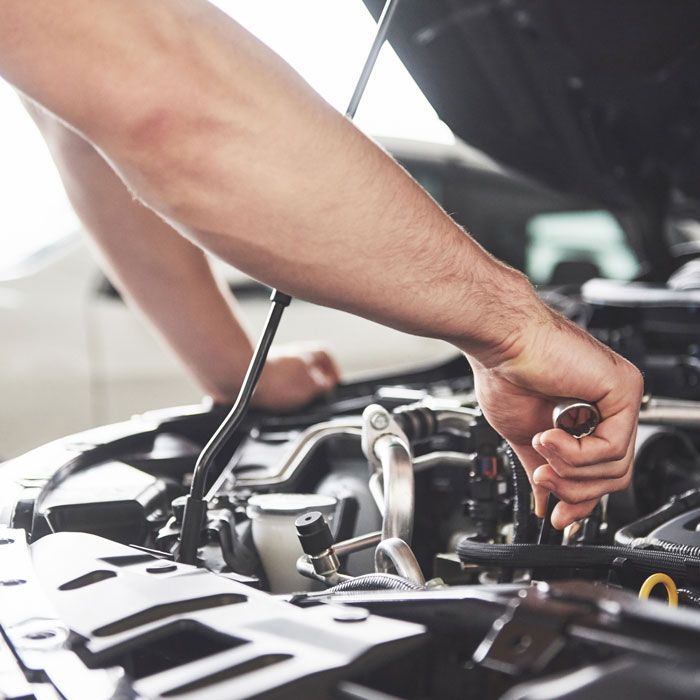 mechanic working on car