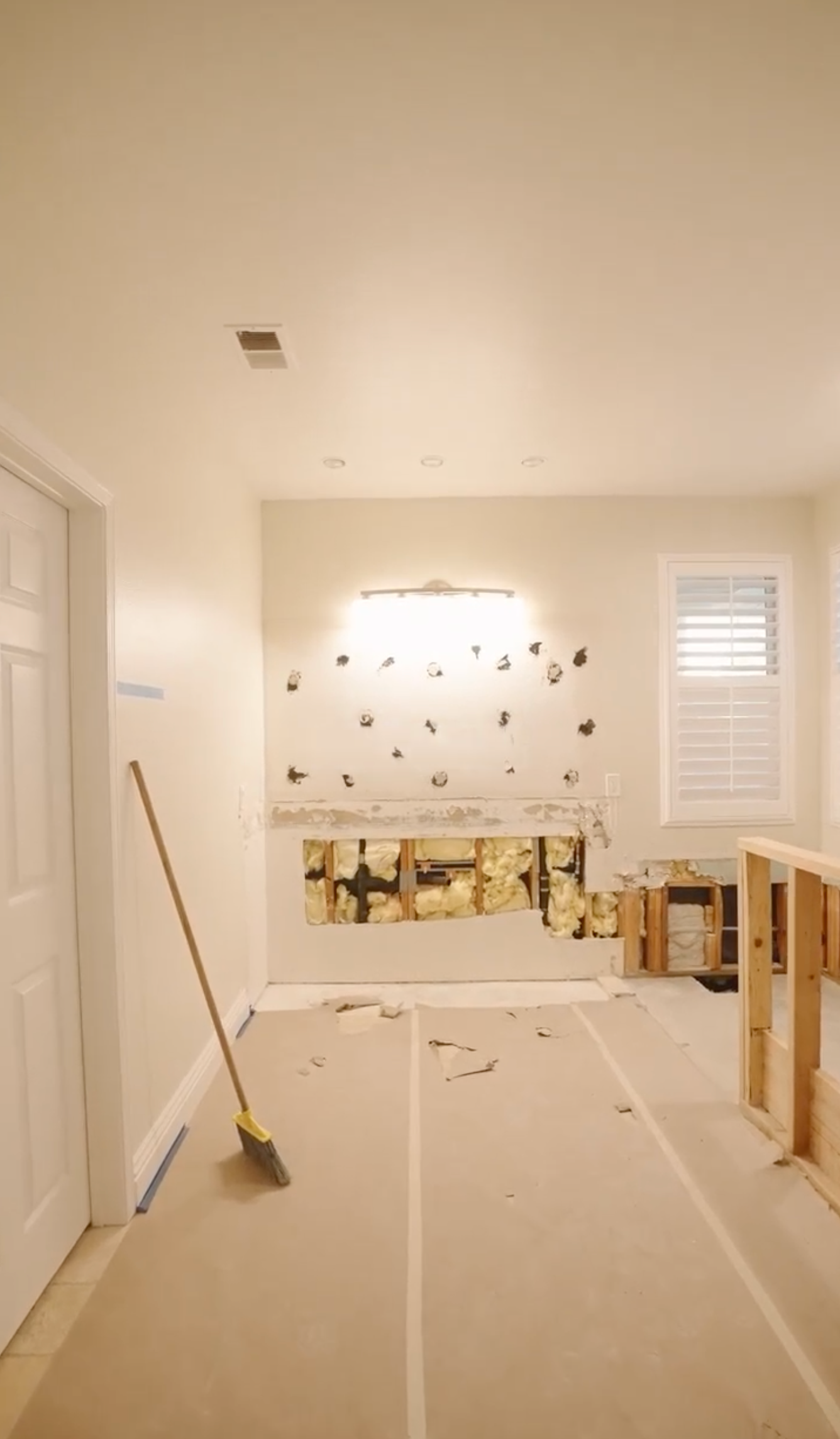 there is a broom in the middle of the room .