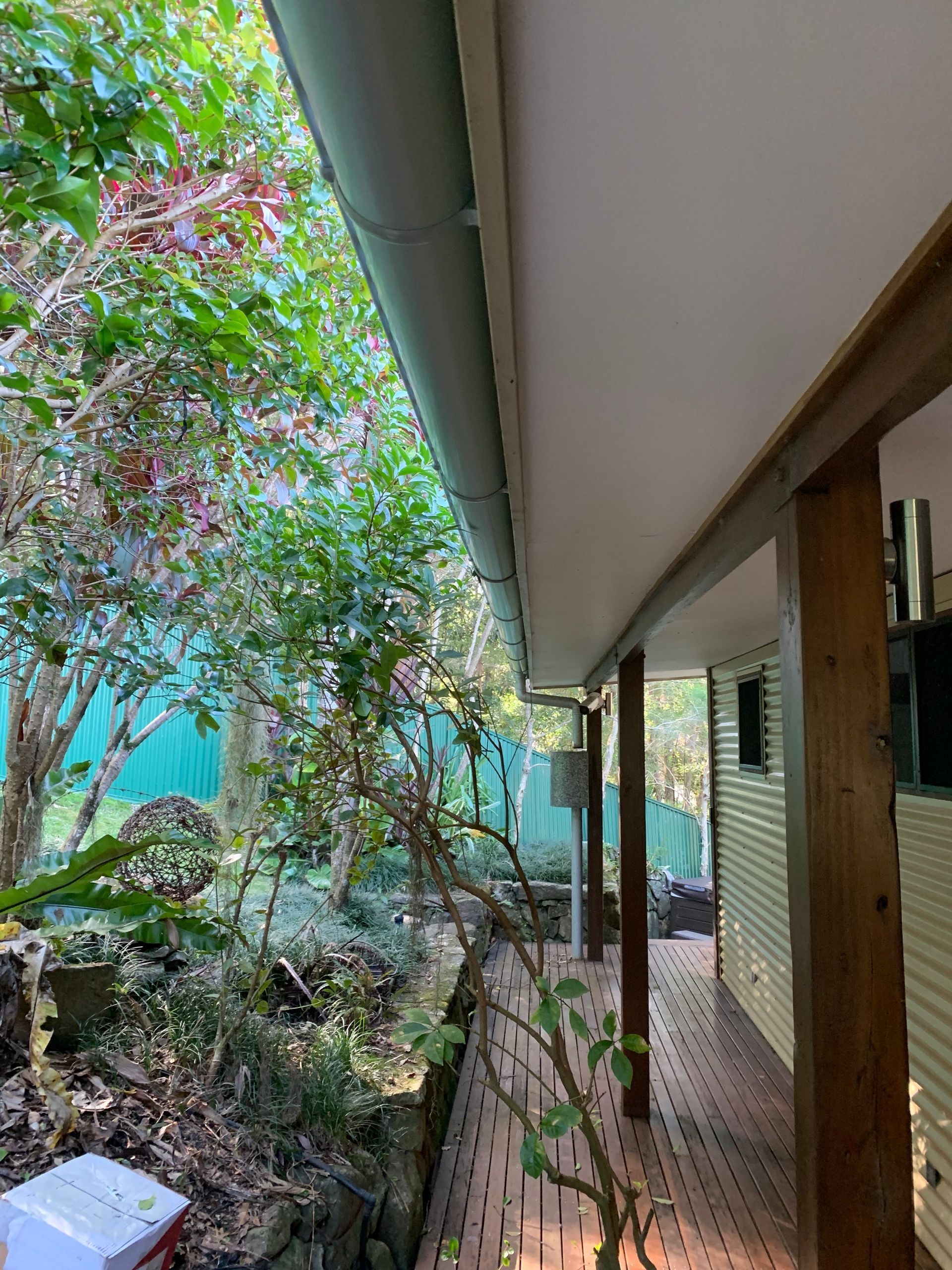 The underneath of a roof showing a long pipe — Blue Sky Roofing NSW In Mullumbimby, NSW